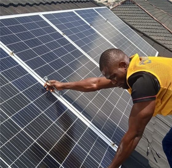 A solar specialist fitting panels
